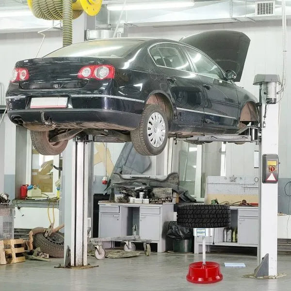 Portable aluminium hub wheel balancer with bull's eye level on an enamel base.