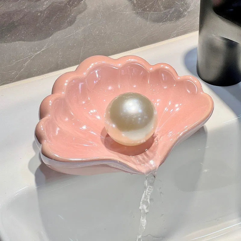 White shell-shaped plastic soap dish for bathroom countertops