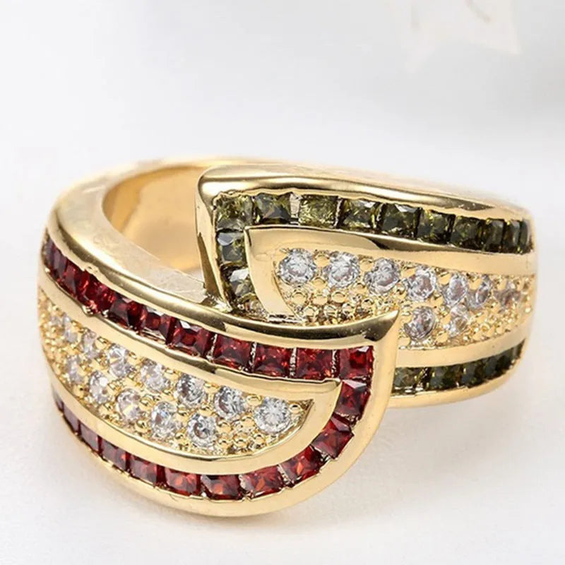 Gold-coloured women's alloy ring with a central green peridot gemstone.
