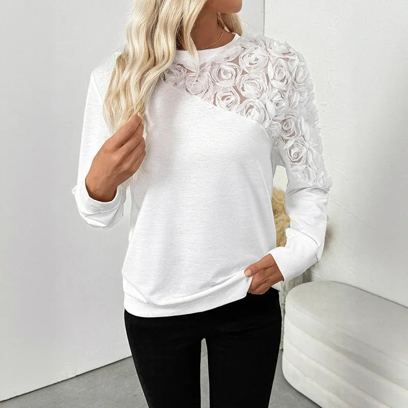 White long sleeve women's top with floral pattern and loose fit design