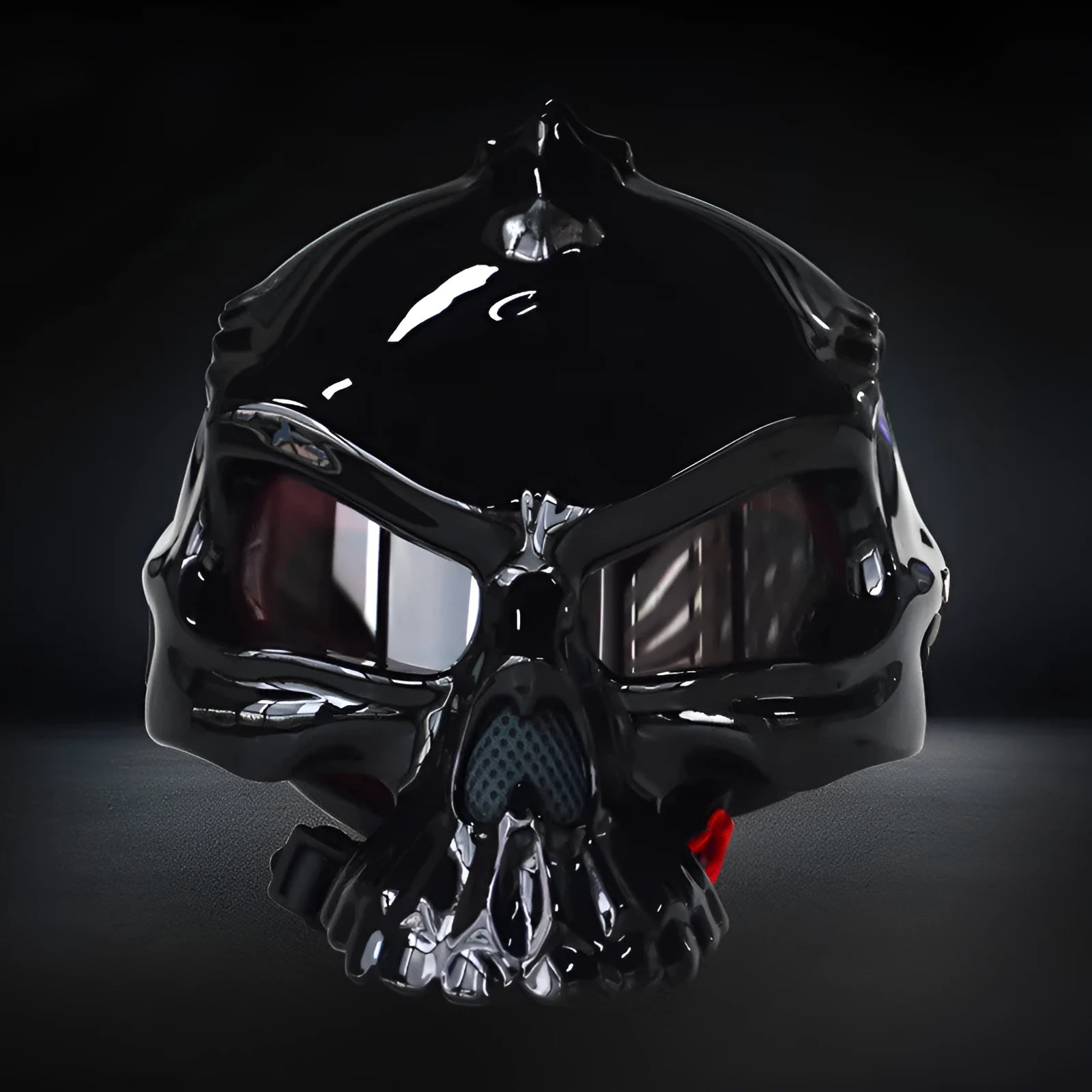 Reversible motorcycle helmet with skull artwork on both sides in black, grey, and red colour options