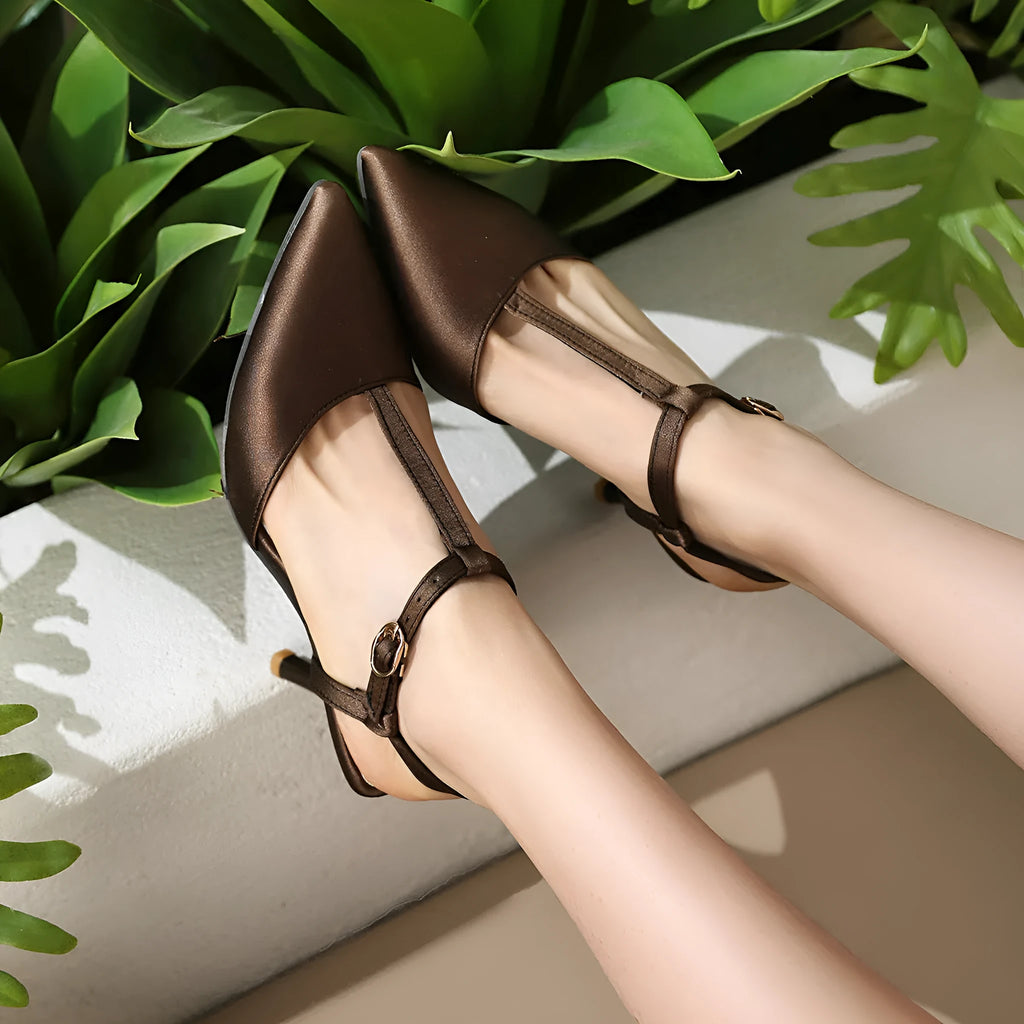 Pointed T-strap high heels in top grain leather, available in black and brown