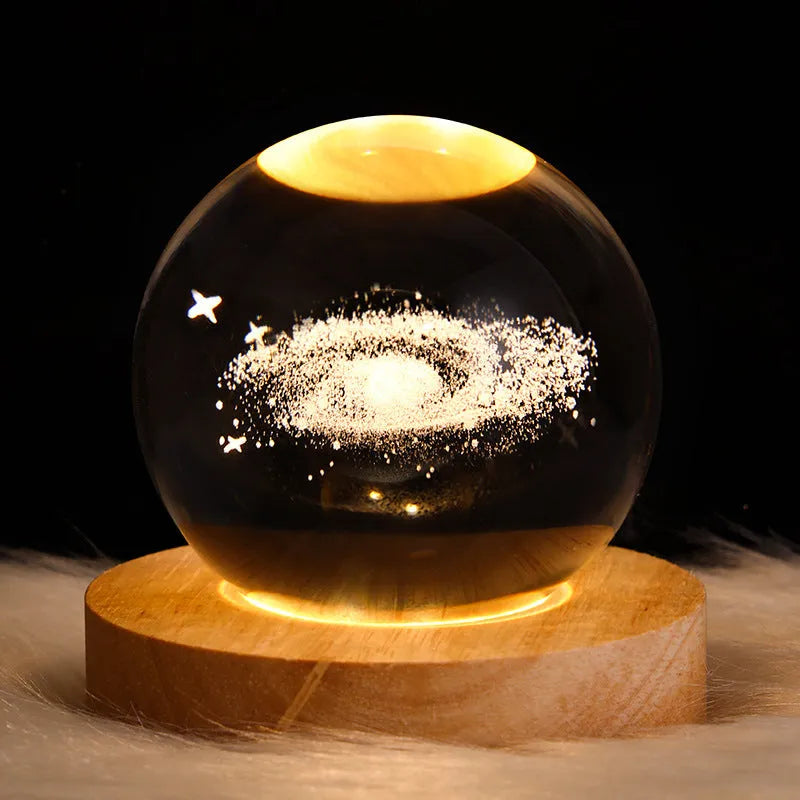 6cm galaxy crystal ball LED night light showing 3D planet patterns with USB power cable
