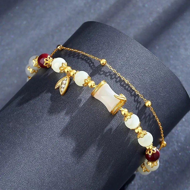 Retro glass flower bracelet with ruyi design in electroplated finish showing beige, green, light green, and white colour options