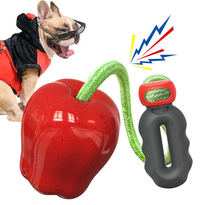 Green and red plastic dog toy with food dropping ball and molar chew design