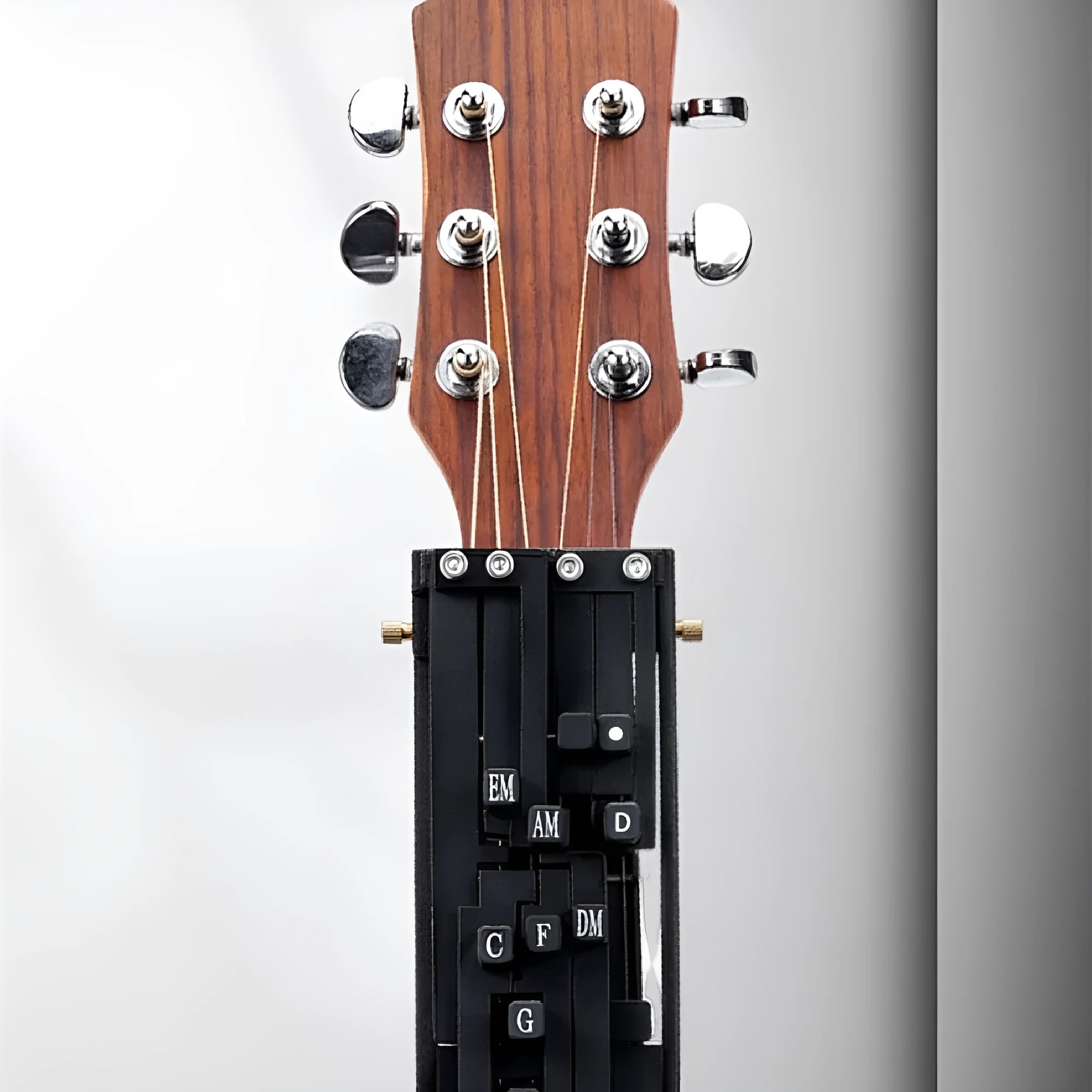 Automatic guitar capo chord device in black and white options for folk guitar playing