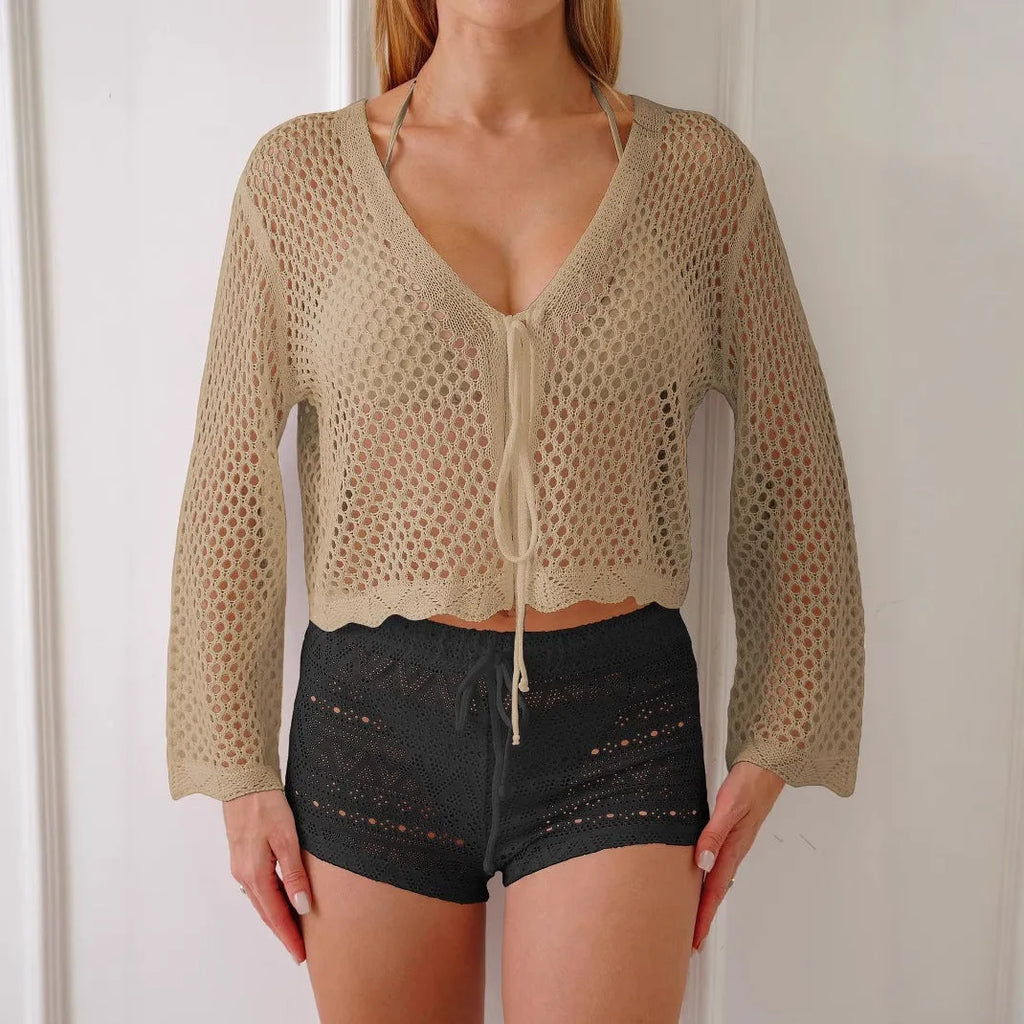 Women's apricot cropped cardigan blouse with flared bell sleeves, laid flat.