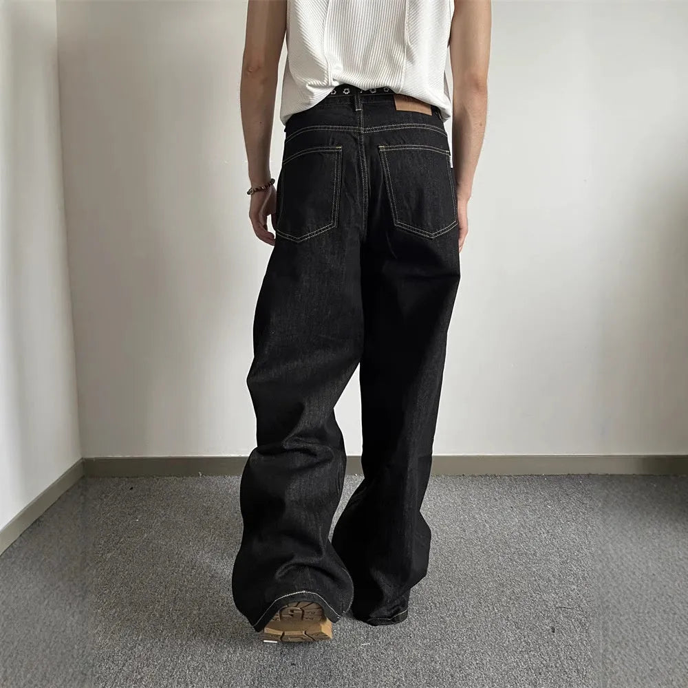 Black retro wide-leg straight jeans for men and women on a hanger.