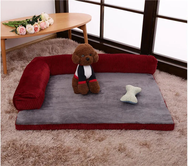 A corduroy dog sofa bed with raised sides in a grey colour, shown on a wooden floor.