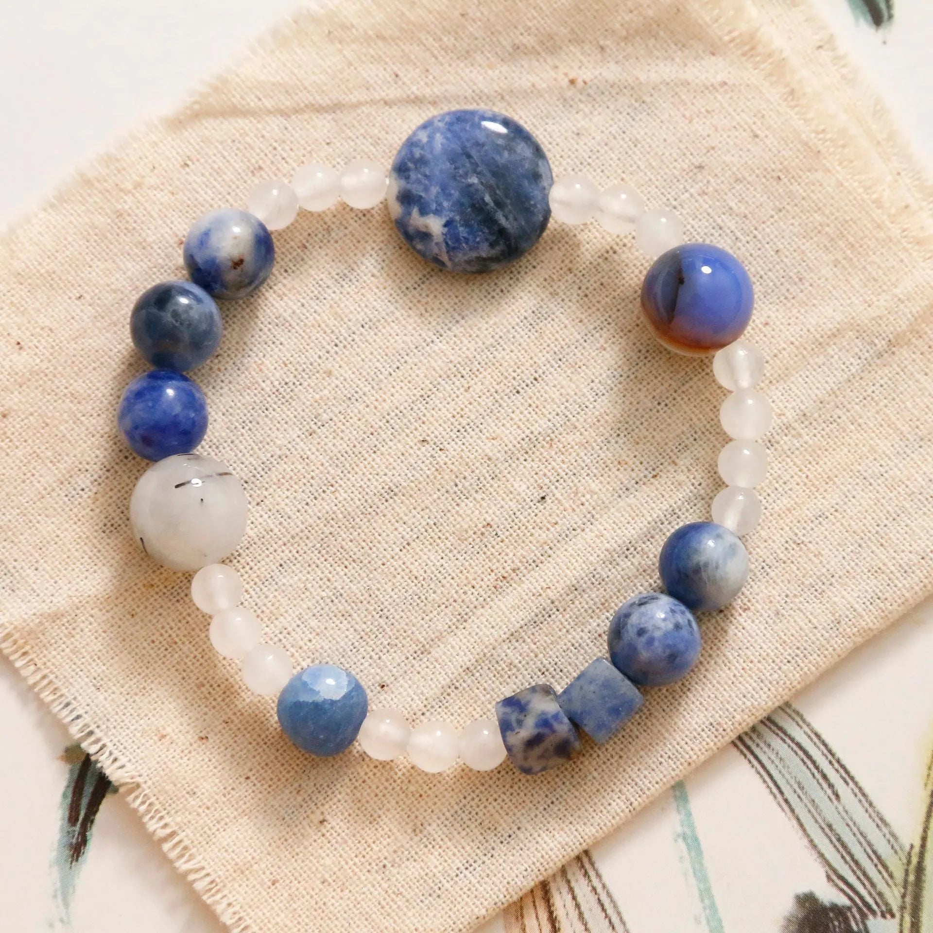 Hand-woven natural blue point and black hair crystal agate bracelet with geometric stone elements