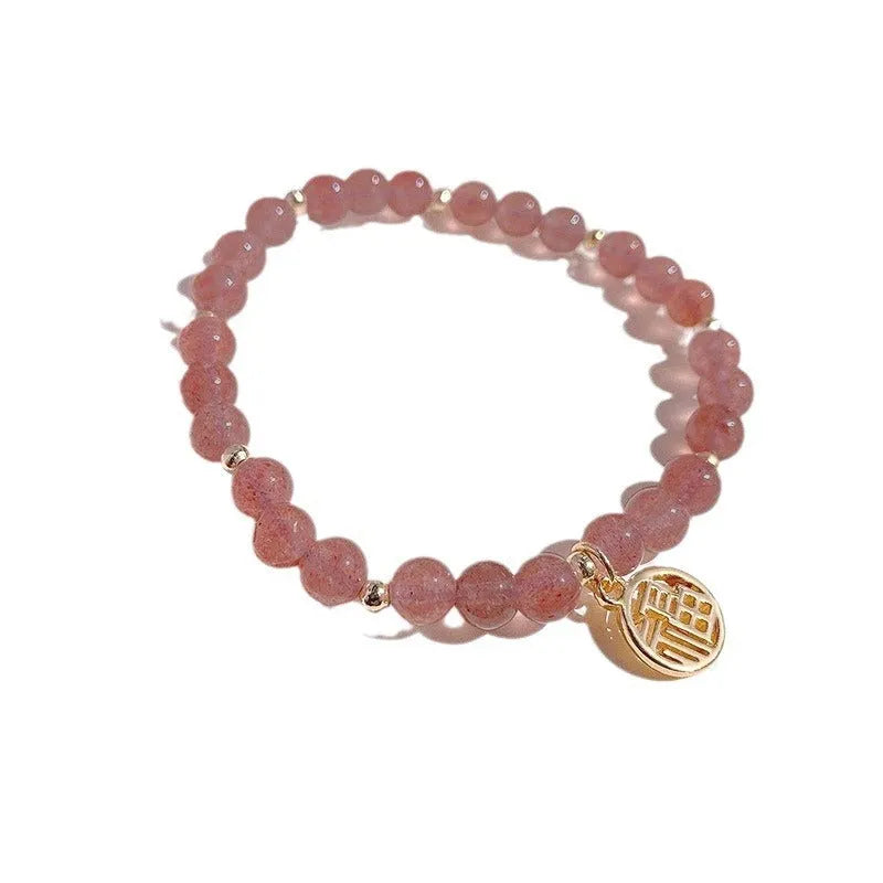 Women's strawberry quartz blessing card bracelet with glass construction and universal wrist size