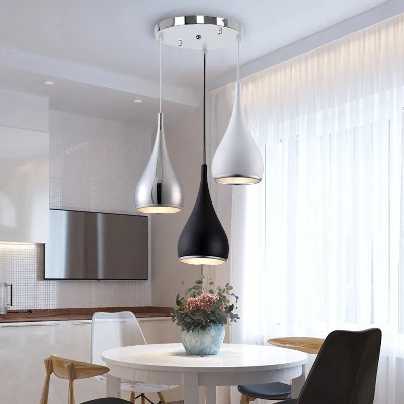 Minimalist iron pendant chandelier with single head or three-head disc and long plate options in black, white, or chrome finish.