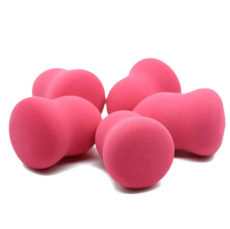 Pink non-latex makeup foundation sponge for wet or dry application, shown next to a ruler showing its 4cm size.