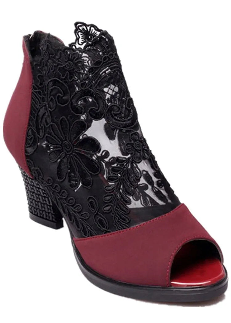 Black lace gladiator sandals for women with a square high heel, peep toe, and a zip closure.