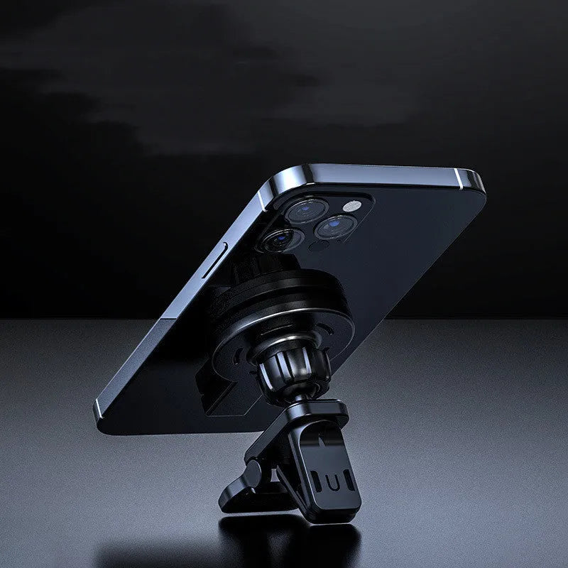 White and black magnetic wireless charger for mobile phones on a desk, showing compact size.