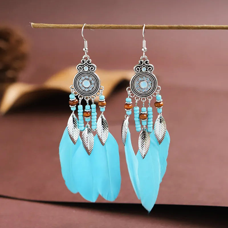 Round drop feather earrings with leaf design in bohemian style available in thirteen different colours