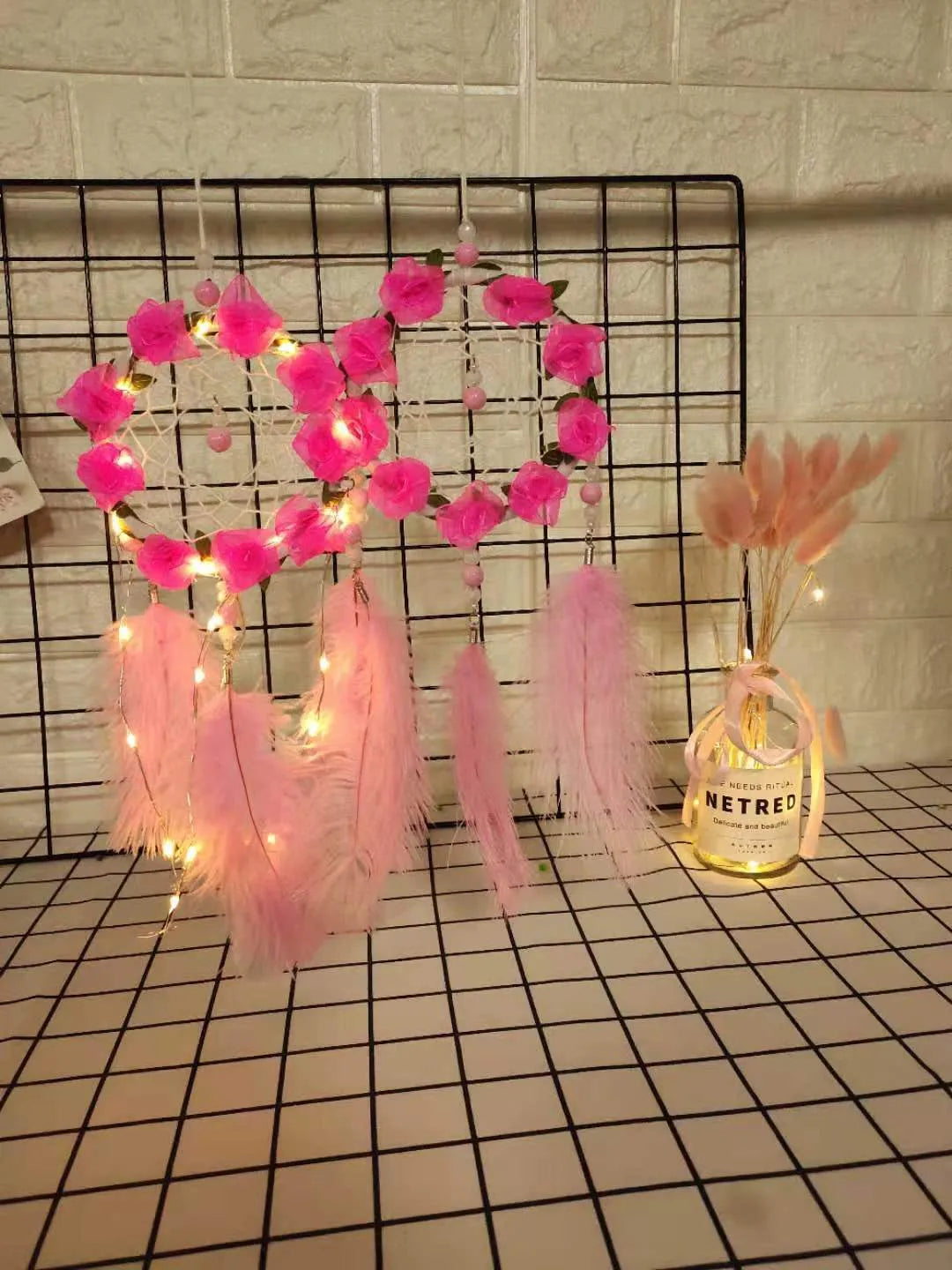 Pink ostrich feather dreamcatcher wind chime wall ornament measuring 10cm