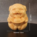Solid bamboo carving ornament of cute pig figure measuring 4cm tall by 3.5cm diameter
