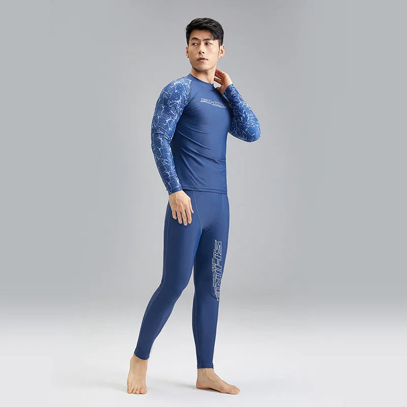Dark blue men's two-piece swimwear set with a top and trousers on a mannequin.