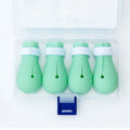 Four green silicone cat anti-scratch foot cover gloves for paw protection during grooming