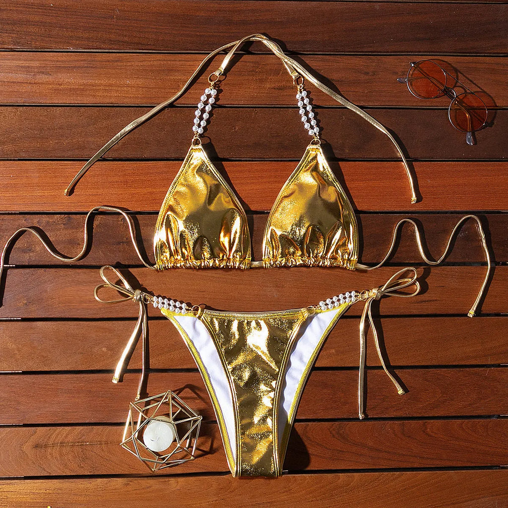 Gold halter lace-up bikini swimsuit with pearl chain fastening on the back