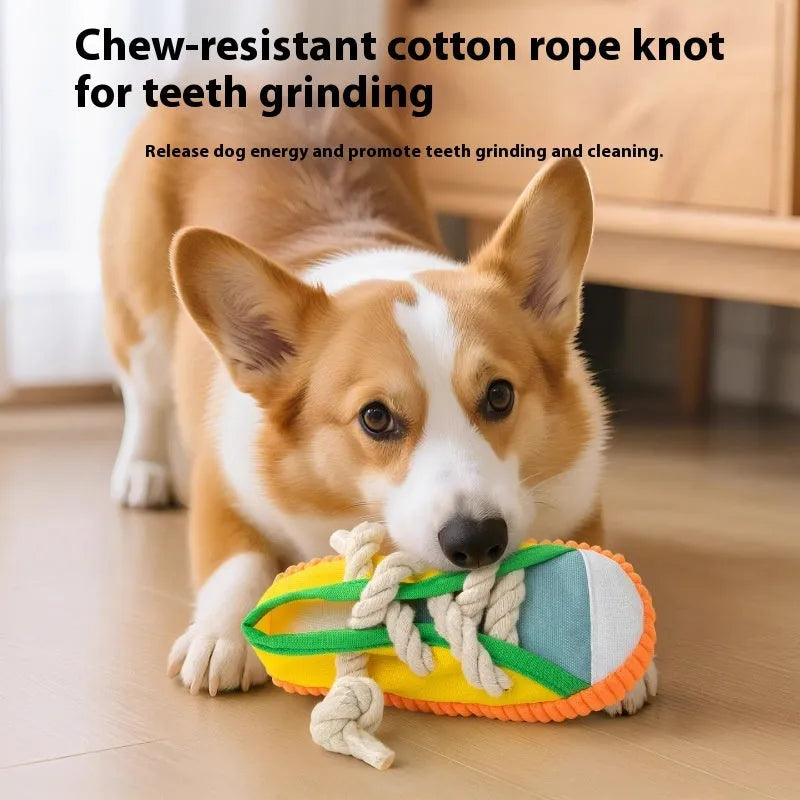 Plastic dog chew toy in slipper shape with sound feature, shown in yellow, black, and blue colour options.