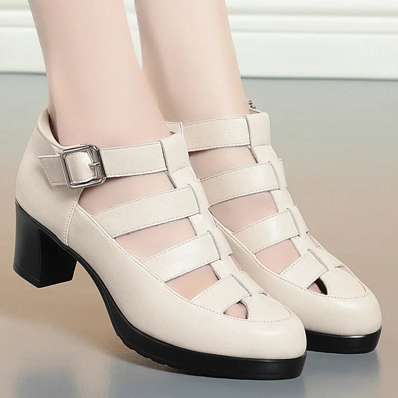 Women's beige closed toe sandals with woven hollowed design, chunky heel, and ankle-strap buckle.