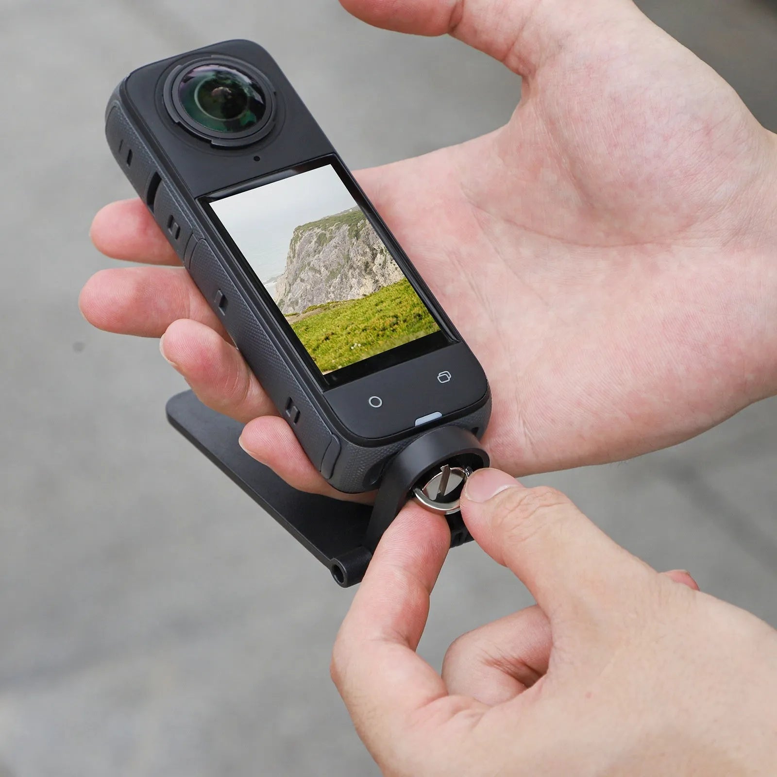 Black magnetic bracket base for Insta360 X4 camera with adjustable angle mechanism