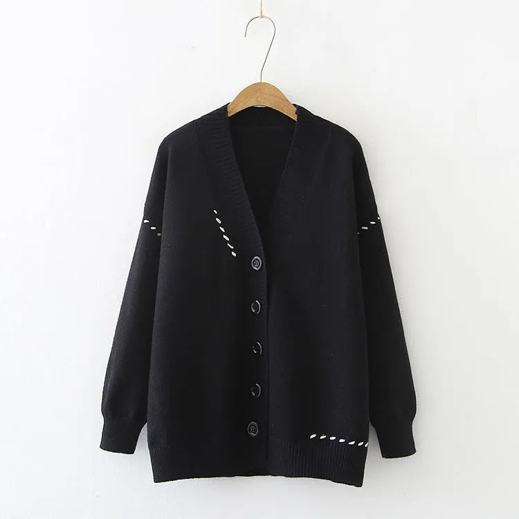 Women's loose fit knitted cardigan coat in black, long sleeve open front design.