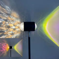 Modern floor lamp projecting water wave light patterns with sunset red or rainbow colour options