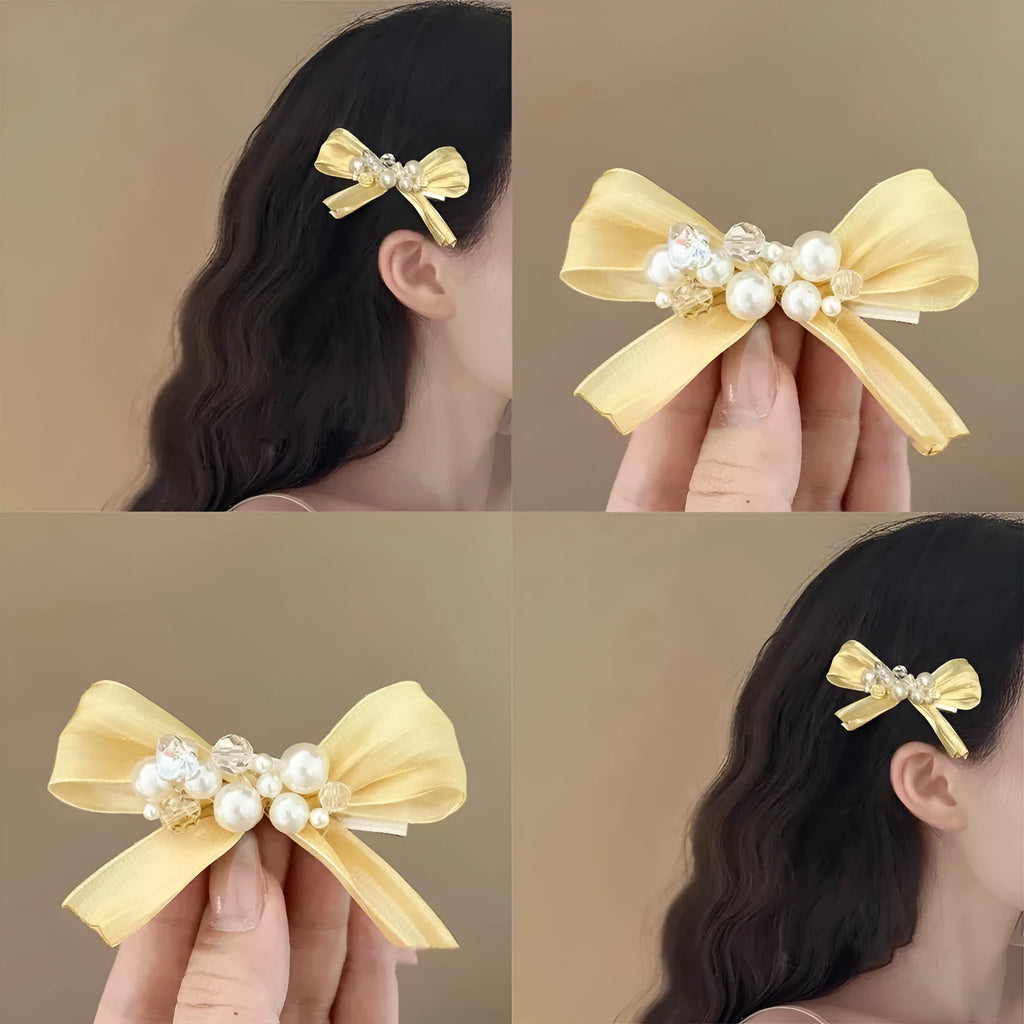 Yellow cloth bow hair barrette with rhinestone and pearl decoration on duckbill clip