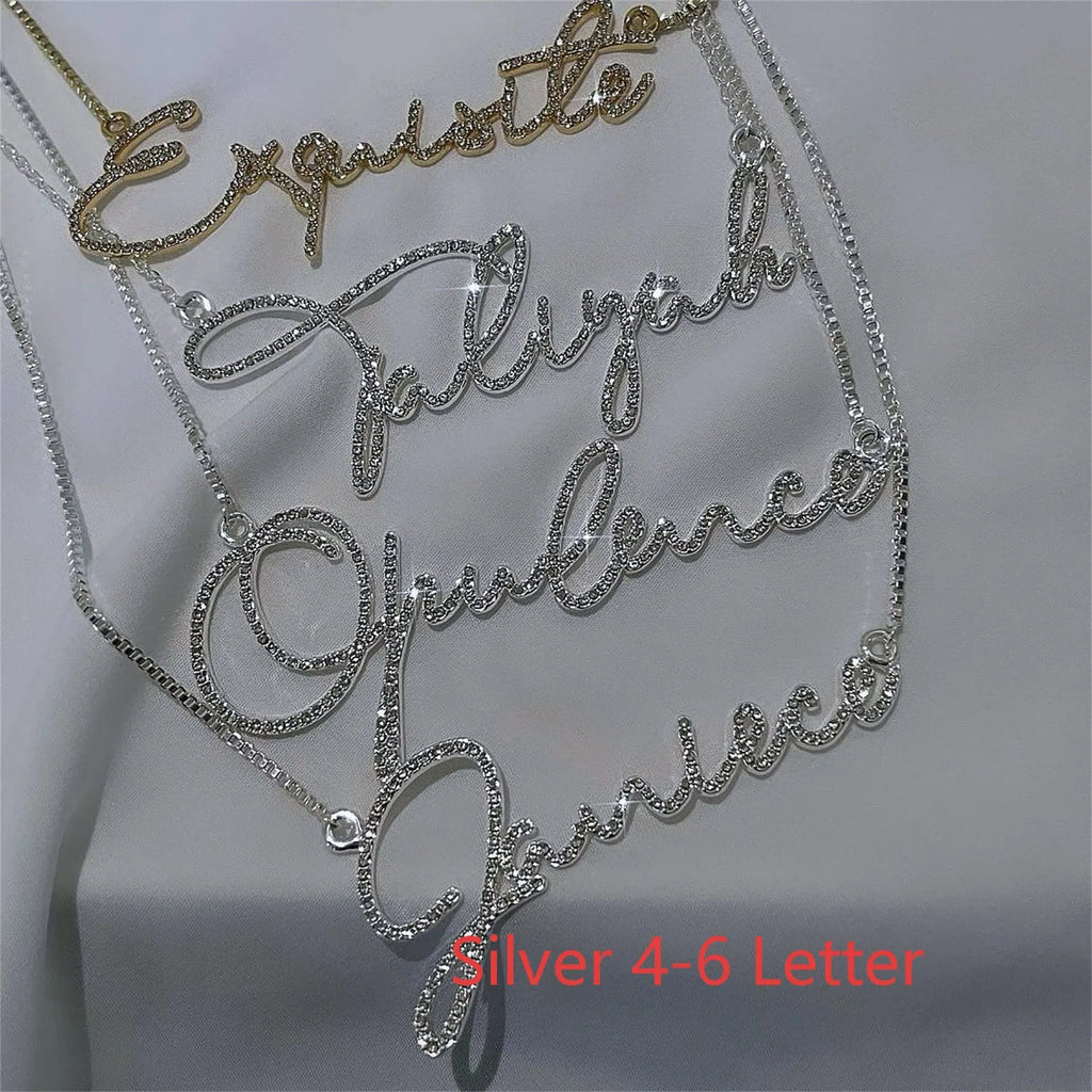Stainless steel name necklace with diamond-studded letters in silver, available in multiple lengths.