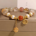 Women's crystal bracelet with colourful hair crystal beads, four pearls, and a Chinese Cai charm.