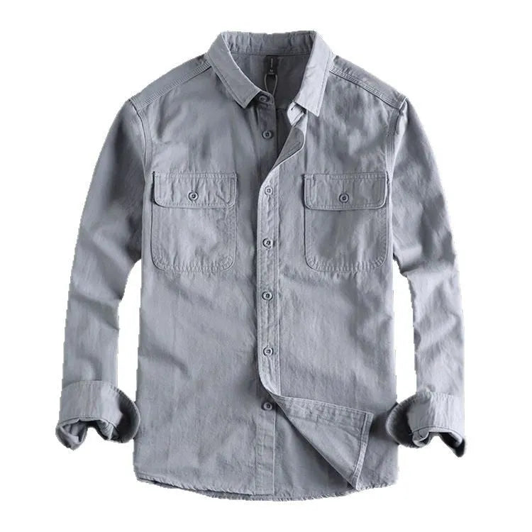 Man wearing a loose grey cardigan-style long sleeve shirt