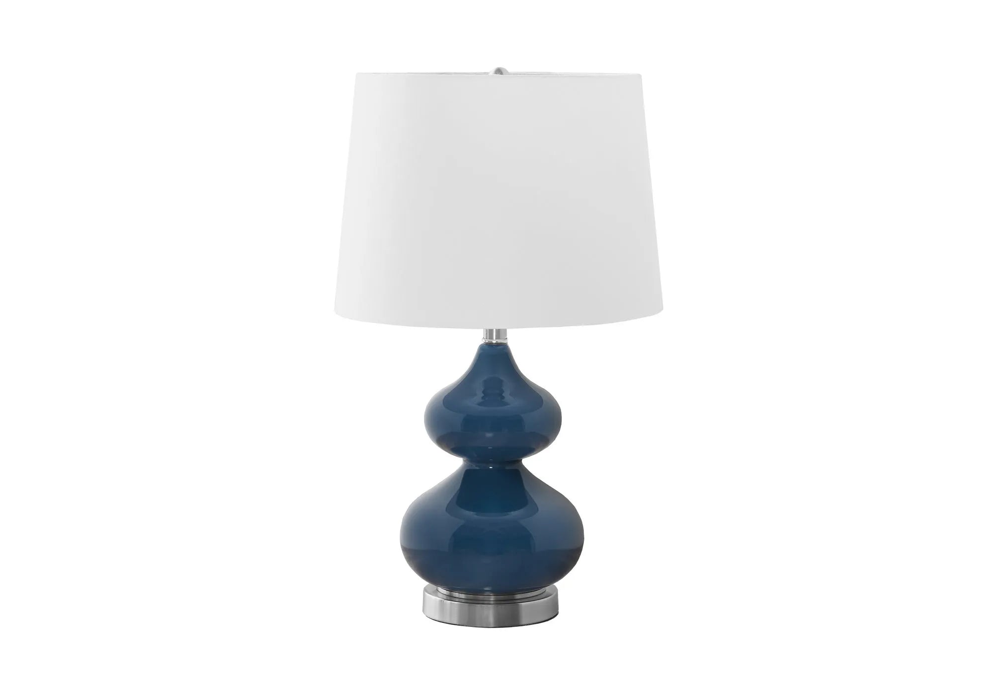 Blue crystal glass desk lamp with white fabric shade on a wooden desk.