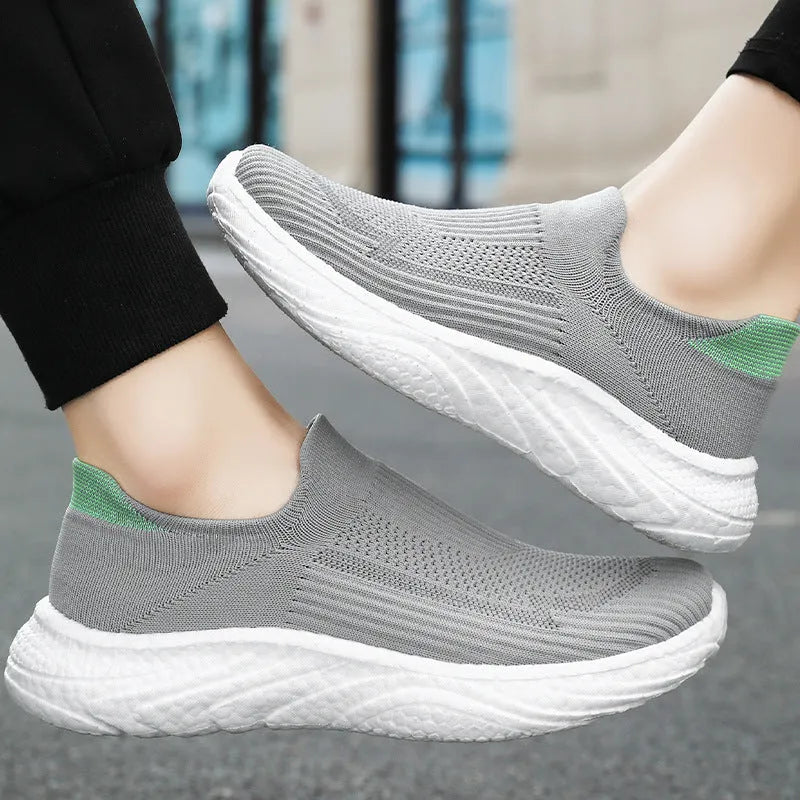 Flying woven casual shoes in black with low top, flat heel, and polyurethane sole, unisex design