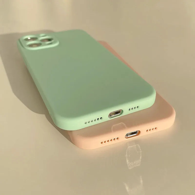 Frosted matte silicone phone case for iPhone 14 on a table, showing the slate blue colour option.