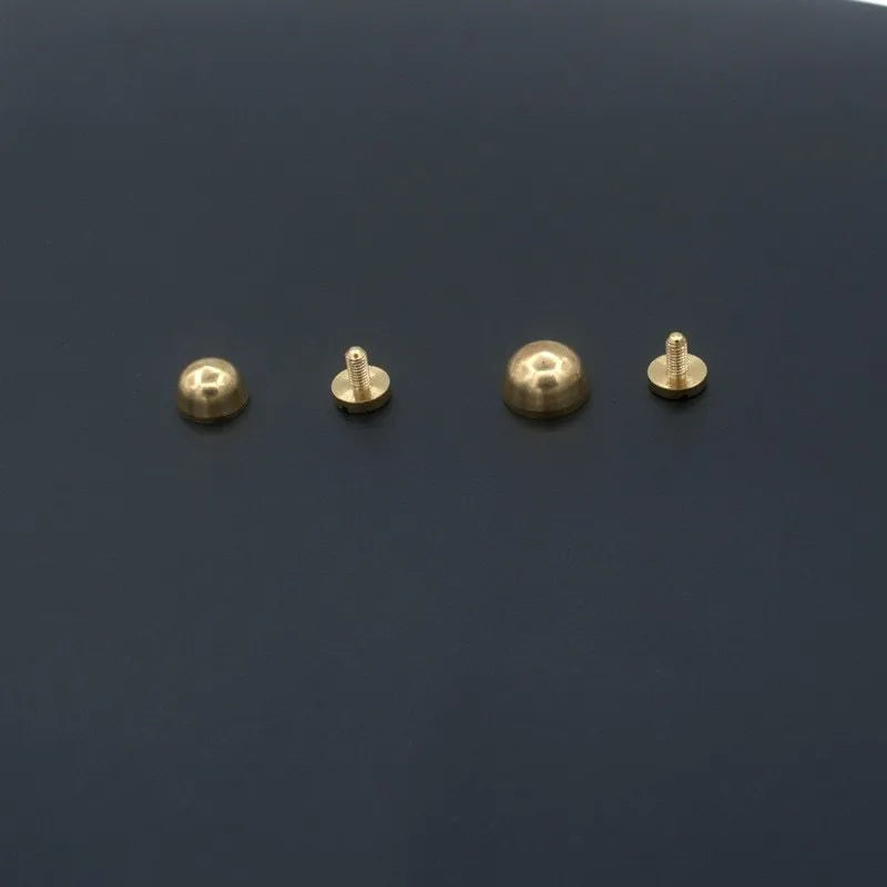 Brass decorative buckle foot nails in round and bucket styles measuring 10x6mm and 12x7mm