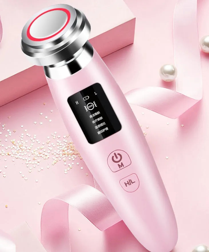 Pink USB-rechargeable facial cleansing beauty instrument measuring 185mm long