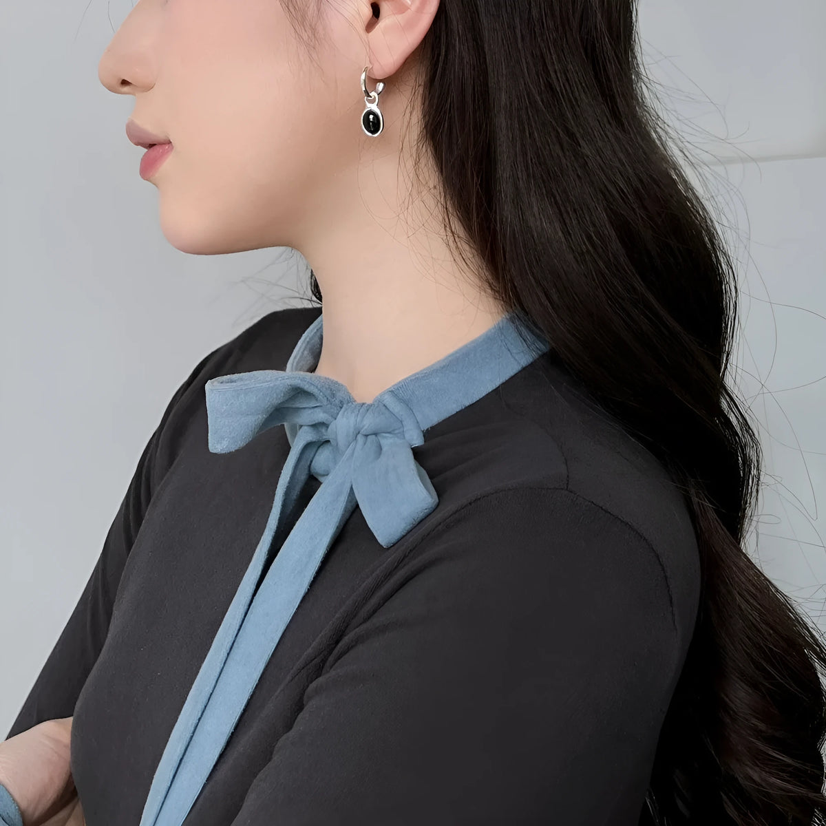 S925 sterling silver stud earrings for women with black agate and a geometric ellipse shape in silver