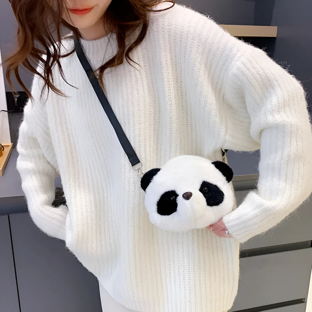 Soft plush panda head design crossbody bag showing cylindrical shape and outer pocket.