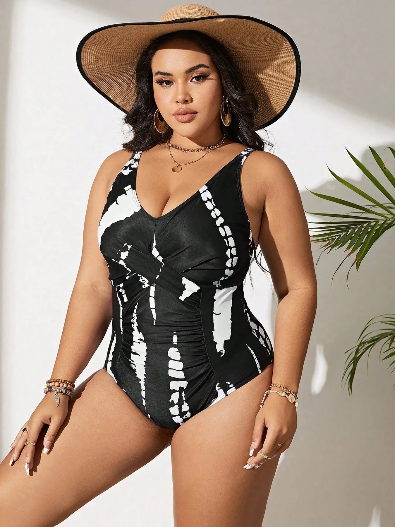 Black conservative one-piece swimsuit with sleeveless design and high-elasticity polyester construction