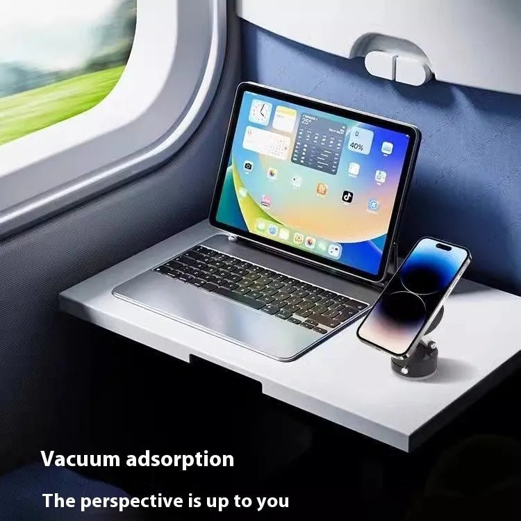 Vacuum magnetic suction phone bracket in black on car dashboard holding a smartphone