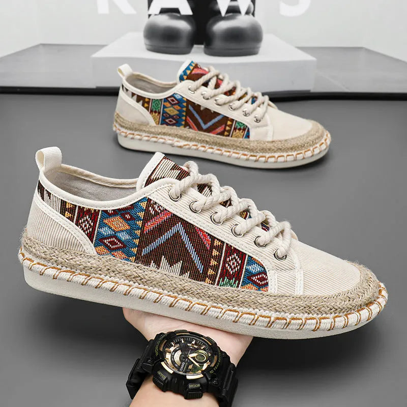 Men's beige and black cloth casual shoes with round toe, shown from the side.
