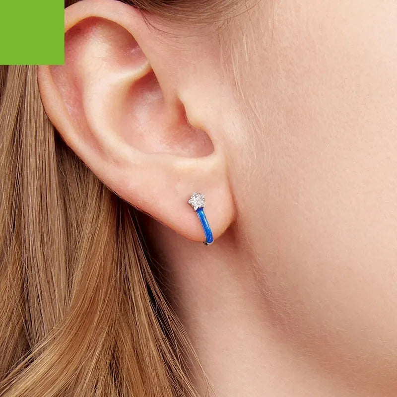 Pair of 925 sterling silver blue star pentagram ear clips with drip oil finish on white background