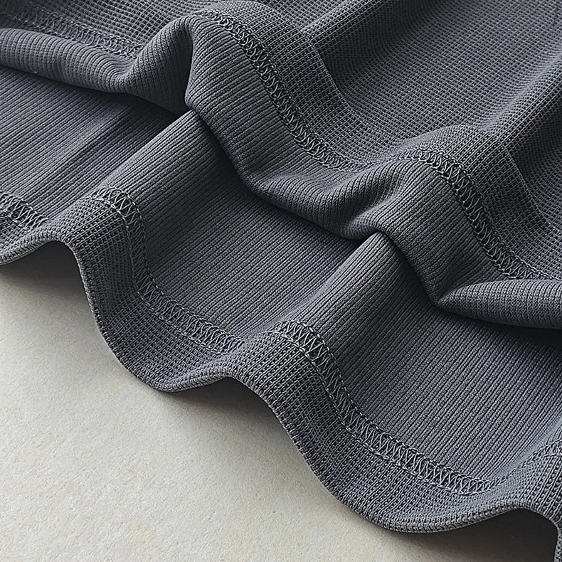 Men's heavyweight waffle-knit short-sleeved t-shirt in a solid colour, showing textured fabric detail.