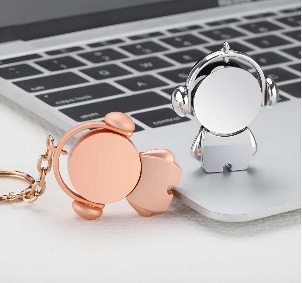 Silver and rose gold metal USB flash drives with a cartoon musician graphic design.