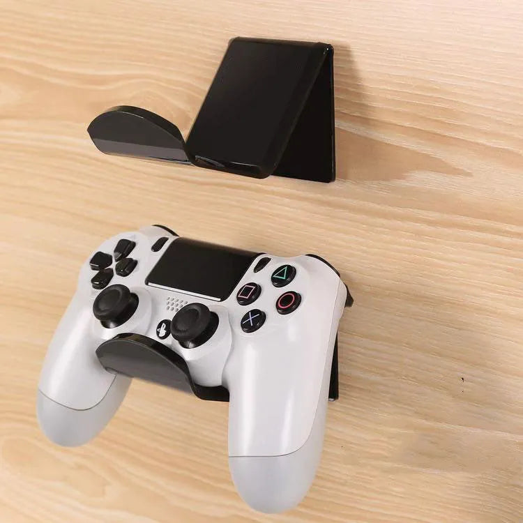 Universal game controller wall mount bracket in black colour shown mounted on wall