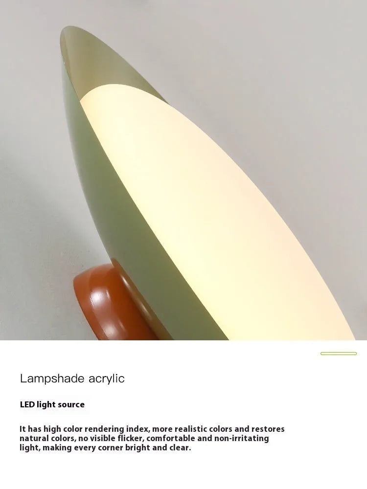 Modern minimalist cream style flying saucer ceiling lamp in a neutral colour on a ceiling.