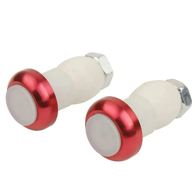A pair of anodised aluminium bicycle handlebar end lights in a choice of colours, showing the red LED and white rubber switch.